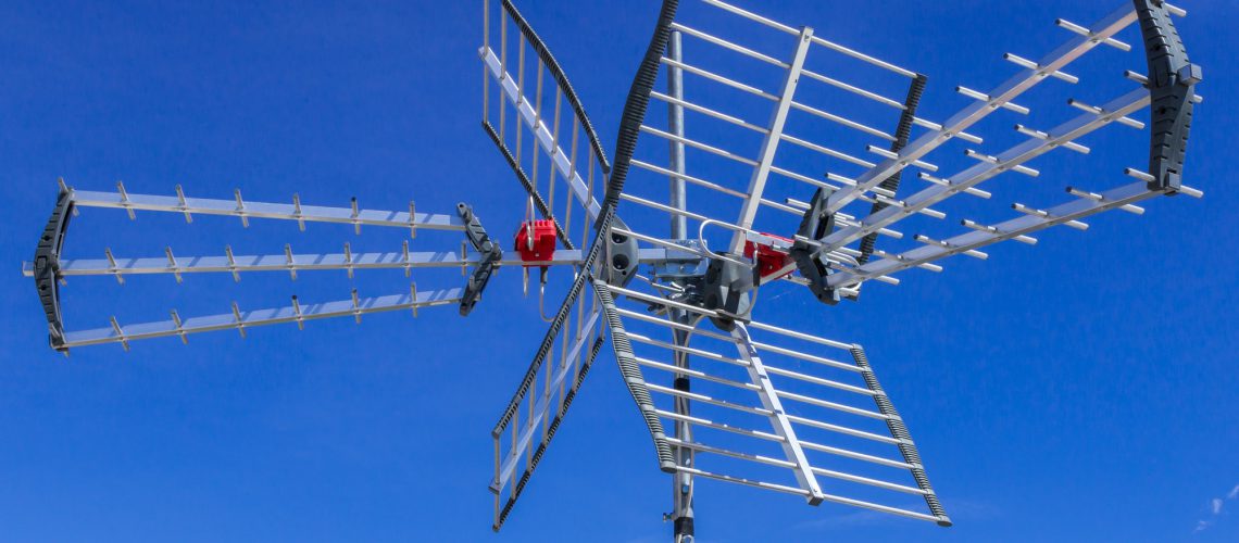 Tv antenna against blue sky